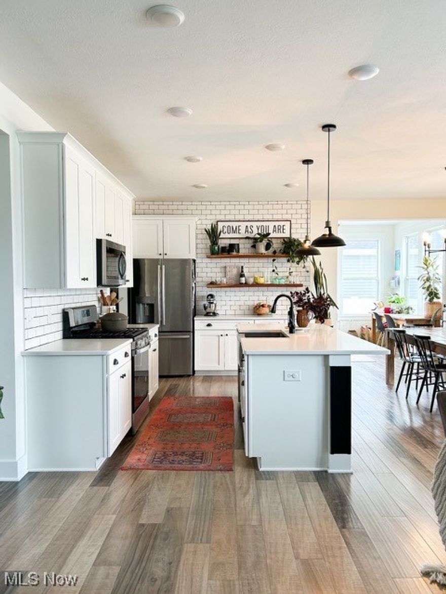 Beautiful 4 Bedroom home situated in convenient location to expressways and shopping. Home has stunning curb appeal with a mix of Stone and Vinyl siding. The Kitchen and Living room have an open floor plan with an Island and Brick fireplace and sunroom off of the Kitchen. There are Sliders leading to the cement patio out back with a vinyl fenced yard. The 12 foot ceilings in Study and luxury engineered hardwood flooring throughout give the home a large feel. The master bedroom has plenty of space with master bath including separate shower and tub and good closet space! The bathrooms both have tile floors and double sink vanities. The basement has great storage areas or could easily be turned into a Recreation room. This home is very appealing and has plenty of space for a family. All kitchen appliances stay with home!