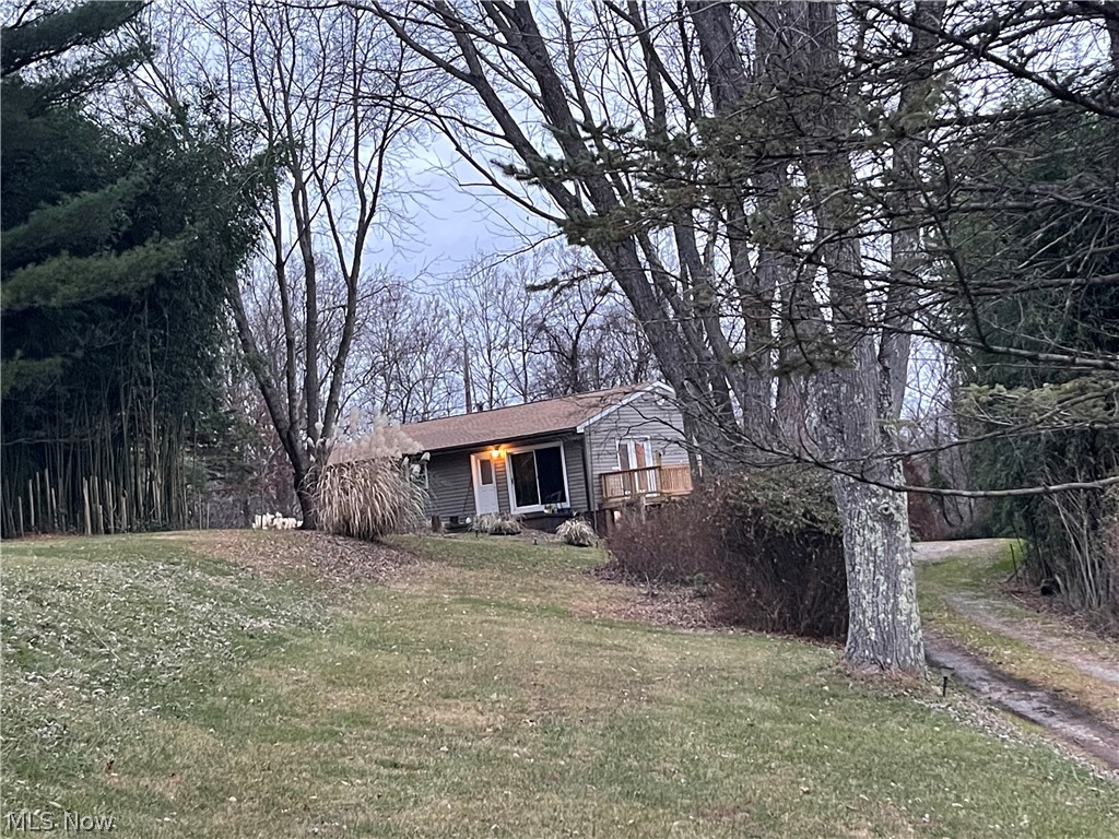 1.17 Acre Tract with a 1-Story Brick Ranch...Home is Nessled down a long driveway to this 3-Bedroom 1 full 2- 1/2 Bathes.. This Beauty is looking for a new owner that sees all of its potential.. This home features oversized hallways great for funiture or accessibility, this home also features a full walkout Basement for easy access... it has newer windows, siding, roof & furnace...sitting on a 1.13 Acres Tract.