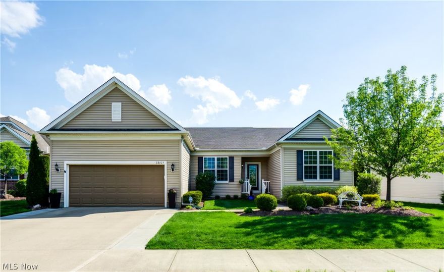 LOCATION! LOCATION! LOCATION! Don’t miss your chance to live right across from North Ridgeville’s premier active adult clubhouse, complete with indoor/outdoor pools and resort-style amenities at your doorstep!  This stunning Reflection model makes a statement from the start with a gorgeous stained-glass front door. Inside, the open-concept layout is perfect for both everyday living and entertaining.  The chef-inspired kitchen features a large island with pendant lighting, rich maple cabinetry, Mannington laminate floors, a spacious pantry, and newer appliances, all flowing into the expansive family room and bonus space, ideal for a media room, bar, or entertaining hub.  Step out to the covered porch addition and enjoy seamless indoor-outdoor living year-round.  The home offers dual master suites perfect for multi-generational living, each with its own bath.  A stylish stained-glass accented room off the foyer makes a great office, den, or retreat.  The large basement offers a separate finished room ready for your personal touch with flooring, along with a Lennox furnace, upgraded dual-float sump pump, radon mitigation system, ERV system, and Aprilaire humidifier for improved air quality throughout the home.  Added benefits include a newer roof, an oversized finished garage with a 4-foot extension, and an irrigation system, all contributing to a comfortable, low-maintenance lifestyle.  Location, Space, and Style, this one has it all!  Schedule your private showing today and ask for the full list of updates.