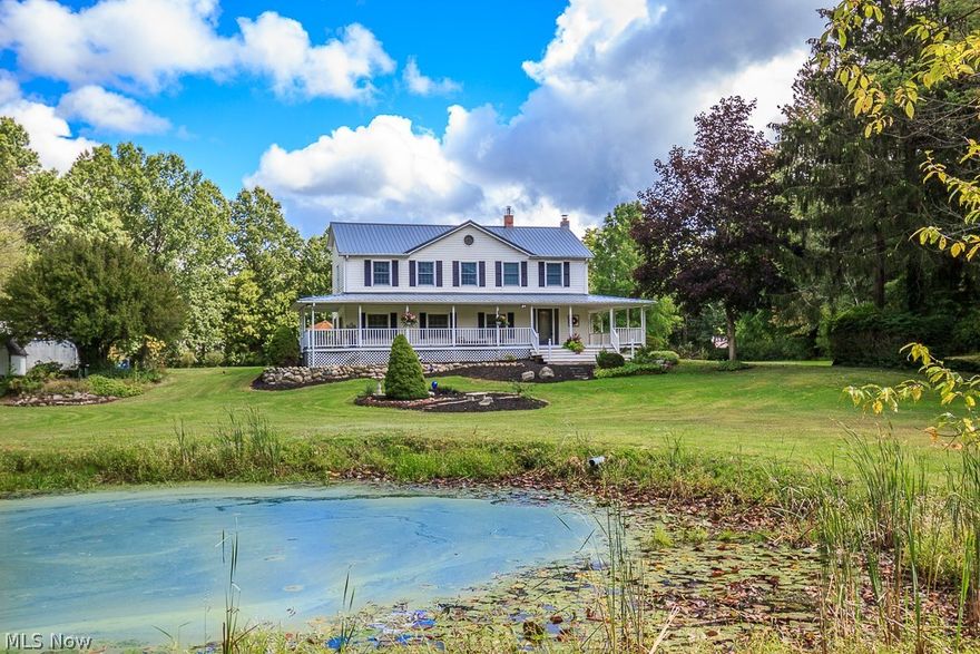 Nestled in the heart of a gorgeous piece of land!  Set far back from the road with total privacy with an estate like feel!  Inviting wrap around porch is the perfect place to enjoy morning coffee and overlooks the majestic pond. Every inch of this home has been updated and lovingly maintained.  Addition done in 1995 to include the 2nd story.  Kitchen beautifully remodeled with granite and huge island/breakfast bar, and kept with the 1860 charm by incorporating the wooden beams in the doorway!  Kitchen is open to huge dining room with panoramic views of back yard.  Family Room has gorgeous wood flooring and moldings!  Master suite is a dream come true with newer carpet, vaulted ceilings and large walk in closet!  1st floor bedroom can also be used as an office!  Enjoy relaxing on patio!  2 outbuildings that can be utilized for any of your hobbies or special interests!  Additional shed available for storage.  New metal roof in 2015.  Your search ends here!