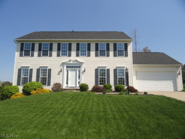 Beautiful Colonial in prestigious Springbrook Reserve! Quality built with tasteful décor and custom molding and trim throughout. Step into the 2 story foyer entrance with gorgeous new cream colored porcelain tile that continues into the kitchen where you will find cherry cabinets, granite counters, island bar and sun lit morning room with vaulted ceiling and wall of windows. French doors to formal living room or first floor office. Elegant formal dining room. Spacious family room with 9 ft ceilings , floor to ceiling windows and gas fireplace. First floor laundry too! 4 spacious bedrooms and 2.5 baths. New deck porch overlooks beautiful yard and lovely neighborhood.