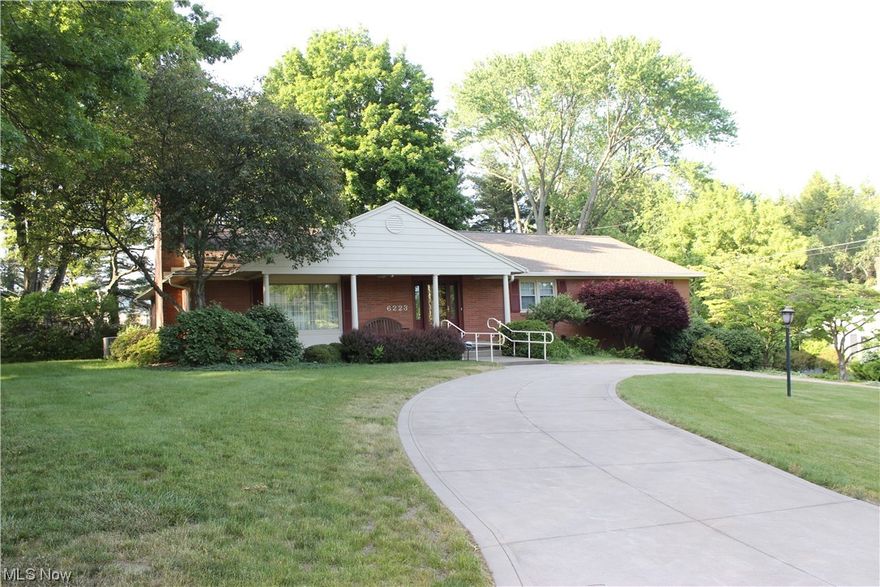 Brick Ranch in Nottingham Village has been well-loved, & offers nice curb appeal with it's circular front driveway, covered porch & landscaping. You'll admire the quality workmanship from days gone by around every nook & corner. Spacious  Foyer leads you into the LR with it's stunning fireplace & custom bookcases. Formal DR then leads to doors to the back brick Patio w/ mature trees, a shady spot to enjoy the outdoors and entertain. Spacious, updated eat-in  Kitchen opens up into charming sitting area w/ bookcases & wall of windows overlooking backyard. Updated main Bath w/stackable wash/dryer. Owners suite w/private bath along with 2 other 1st floor Bedrooms. Rec Room w/2nd fireplace offers a cool retro vibe w/more custom bookcases, 1/2 bath, & large unfinished storage. Oversized 2 car garage w/electric car charging station! Lawn sprinkler system too. Newer roof, furnace, CAC, electric. Immediate possession.