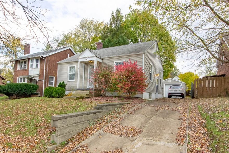 A fantastic vinyl sided, single story cape cod style with finished basement, detached garage and fenced yard in Goodyear Heights. There's a lot to like about this home for the price. The property is ready to move in or rent out. The original hardwood floors throughout the property are in excellent shape, there's a fresh coat of paint throughout. The replacement vinyl windows offer some additional energy efficiency, stay cool with ceiling fans throughout. The bathroom was remodeled including a tub-surround and modern fixtures. The finished basement features a family room and home office, ready for your flooring. The fully fenced-in yard features a deck, paver patio, and detached garage. The kitchen offers a breakfast bar, stainless steel sink with garbage disposal, side by side refrigerator/freezer, built-in microwave, dishwasher and a range-oven. There are some updates throughout including a new hot water tank in 2017, new exterior steel doors, vented glass block basement windows and s