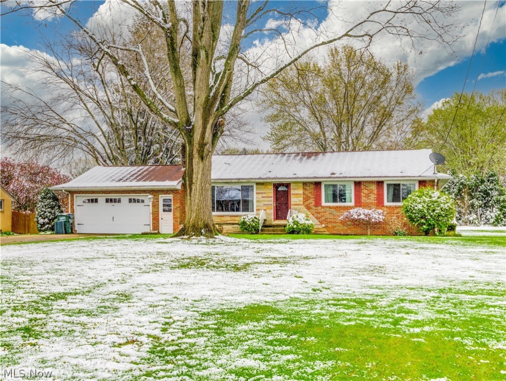 Imagine starting your mornings in the sun-soaked living room and when the Ohio weather decides to snow in the spring cozying up to the fireplace. There is an eat-in kitchen with updated flooring (2020) that opens to a spacious backyard from the sliding glass door. On the main floor, you will find 3 bedrooms with wood flooring and a full bathroom. The basement is partially finished with plenty of space for storage or a bonus room. The basement living room offers a second fireplace as well as a second full bathroom.