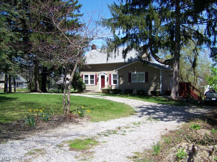 Many Updates! Windows, bath and more! Fresh paint, gleaming hardwood floors thru-out, 1st floor master! Beautiful brick fireplace in cozy living room. Formal dining room with french doors leading to office with sliders to deck overlooking rear yard. Walk-out basement. Huge heated and C/A barn with office and 2nd story. There's more!