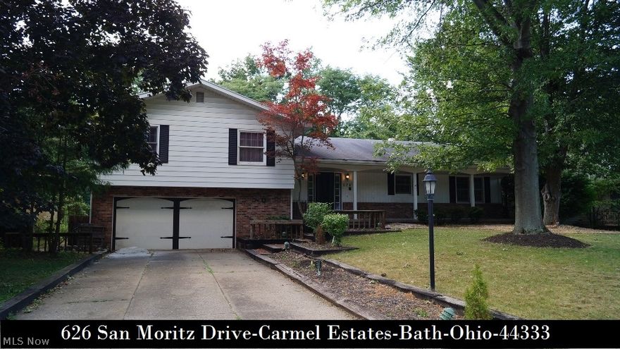 Bring your decorating and updating ideas to this 4 Bedroom Split-Level in quiet Neighborhood on mature treed lot! Spacious Living Room - dining room -  family Room with fireplace, all with hardwood floors, master bedroom with private bath and walk-in closet, den/office/5th bedroom, full front porch and sun room overlooking back yard with large deck & patio! REVERE SCHOOL DISTRICT! Act quickly!