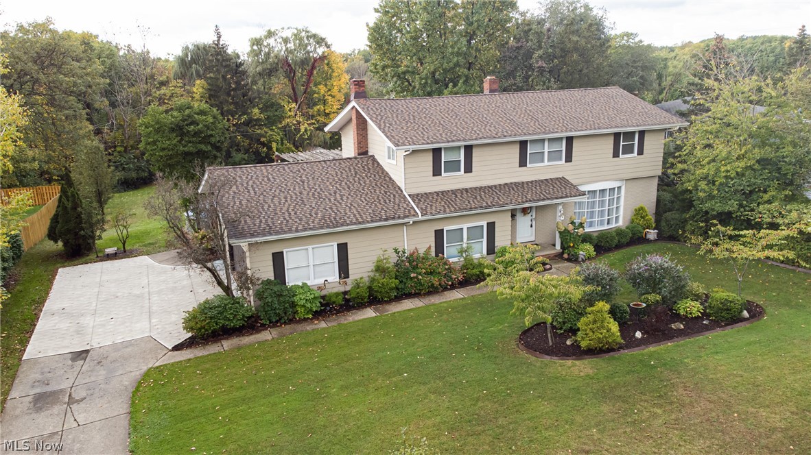 Welcome home to this 4BR & 2.5 Bath Center Hall Colonial in Broadview Heights that has been well maintained by the same owner since July 1997. It offers an open floor plan w/2,438 square feet of above-ground living space. It features an updated eat-in kitchen w/ cherry cabinets, granite countertops, a large pantry & comes w/newer stainless steel appliances (2018). Off the eat-in area step down into the spacious family room w/wood burning fireplace. Access to the large deck & pool area through sliding glass doors in the family room. The dining room & living room are open to each other providing a ton of space perfect for entertaining. Completing the first floor is a half bath & a mud/laundry room. Washer & dryer are included! Upstairs you will find a spacious master bedroom w/new carpet (Oct. 2021) & a full master bath. There are 3 additional nice-sized bedrooms w/ ample closet space & another full bath that was recently updated w/newer vanity, glass shower door & commode (2018). Downstairs you will find a recreation room & additional storage space. Outside is the perfect outdoor oasis w/a large deck, above-ground pool, Amish-built shed being used as a pool house, a covered hot tub area, a fenced area around the pool, & a 2nd storage shed beyond the fence. The yard extends beyond the fenced area back to a tree line which provides privacy. Updates include AC (7/2020), tear off roof (2017), furnace (2016) & replacement vinyl windows. Please see supplements for further updates.