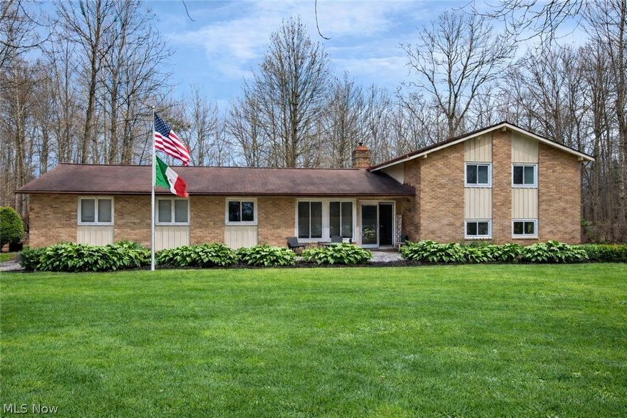 Welcome home to this beautifully updated and well-maintained property nestled on 1.3 acres in a private neighborhood within the desirable West Geauga School District. From the moment you step inside, you’re greeted by soaring ceilings with exposed wood beams, beautiful stone flooring, panoramic windows that fill the space with natural light, and a stunning stone-surround wood-burning fireplace in the living room. The fully remodeled kitchen offers both style and functionality, perfect for everyday living and entertaining. Just off the main living area, a spacious deck overlooks the peaceful wooded backyard.

Upstairs you’ll find three bedrooms—with the potential for a fourth—and two fully remodeled bathrooms. The lower level features a cozy family room with a gas fireplace, a sunroom overlooking the backyard, a versatile flex space ideal for a home gym or hobby room, a laundry room, and a convenient half bath. Gardeners and plant lovers will appreciate the attached 10x16 greenhouse, offering a wonderful space to nurture plants year-round.

Recent updates include a completely redone water system with softener and reverse osmosis (2025), hot water tank (2025), refrigerator (2024), installed PVC deck railings (2024), all new windows and family room slider (2023), wood-burning fireplace insert installed (2023), mini-split A/C (2022), all electrical outlets replaced (2021), all three bathrooms renovated (2021), bedroom flooring (2021), and a fully refreshed family room (2020).

Additional highlights include a whole-house generator hookup, maintenance-free metal siding, and a thoughtfully updated layout designed for both comfort and entertaining.