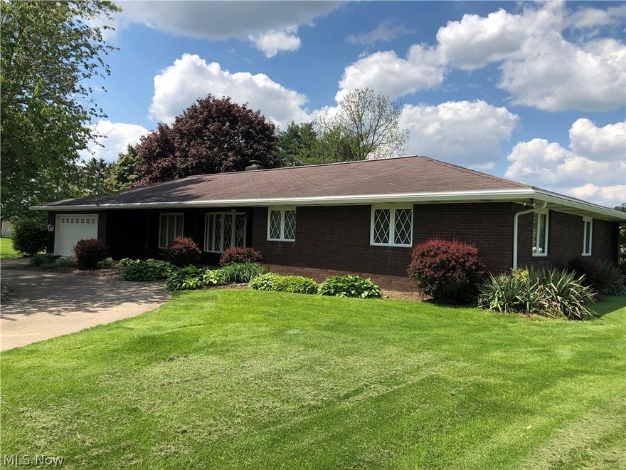 Parcel 1: Here is your opportunity to own a solid 3+ bedroom brick ranch home on a beautiful lot in Kidron, OH. This home features a concrete circle drive, attractive landscaping, and a private concrete patio area in the backyard. On a half-acre lot in Kidron this home features 2,600 S.F. of living space one floor. The floor plan features a kitchen with walnut cabinetry and bar area, dining area, and living room in an open concept. A spacious laundry/utility room, 3 bedrooms, 2.5 baths and a bonus room. Just off the front entrance there is an additional sitting room as well an office that boasts beautiful cabinetry and desk space.  The home also features a 2-car attached garage. The backyard area has a level lawn bordered by vinyl fencing with open fields to the rear of the property. The utilities to the property are city sewer and private well, forced air natural gas furnace, central air and natural gas hot water heat. There is a wood fireplace in the living room as well. All applianc