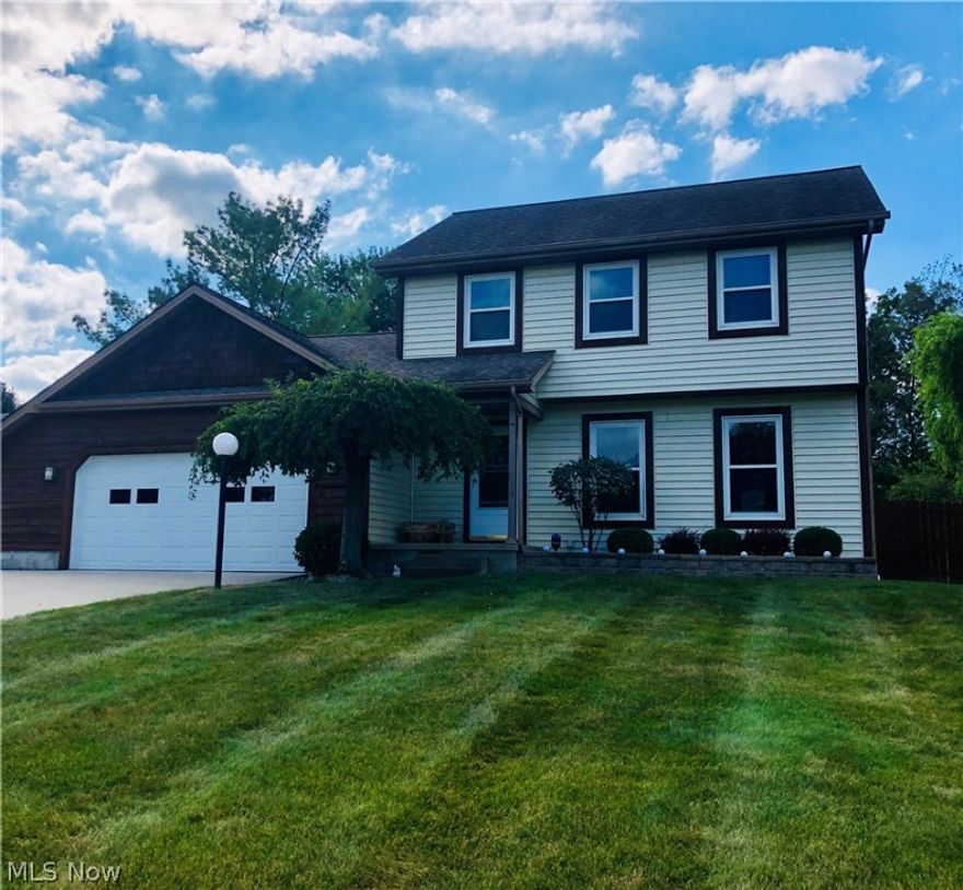 This beautiful 3/4 bedroom home has many updates, been well maintained and is move in ready. High end laminate floors in the open design eat in kitchen and living room as well as granite counter tops, newer windows and concrete driveway. The second floor bathroom was recently remodeled with granite counter tops, recessed lighting and a jetted tub. The french doors from the dining area lead to the double level back porch with a cover and the large fenced in back yard. Come and see it before its sold.