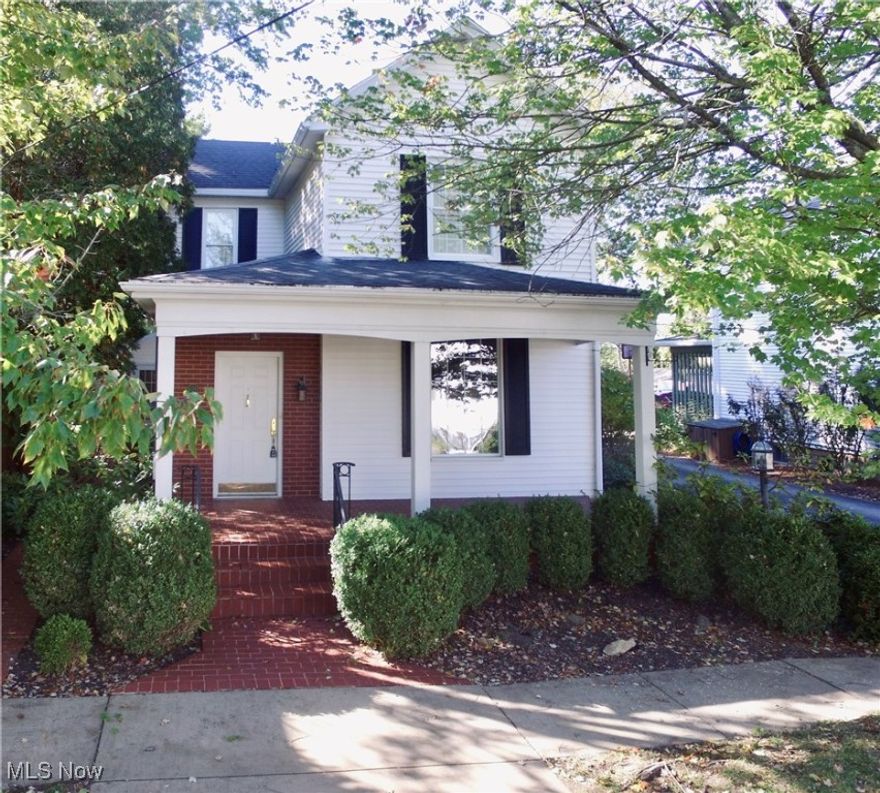 Welcome to 618 Park Street! Built in 1900 and lovingly maintained through the years, this home tells a story of craftsmanship and care. Three spacious bedrooms and an office offer flexibility, while the covered porch and brick courtyard invite you to unwind outdoors. The wooden beams and a fireplace in the spacious sunken living room create a cozy elegant atmosphere. Enjoy the convenience of a first floor laundry room and plenty of closet space throughout the entire home. The flowing floorplan and spacious rooms will make entertaining and family gatherings a breeze!  With the backyard overlooking Shamrock Stadium football field and being within walking distance to Barnesville Memorial Park, this property combines a sense of history with a vibrant community setting complete with classic shuttered windows and built in cabinetry. Character, comfort, and community all in one address. Schedule a showing today!