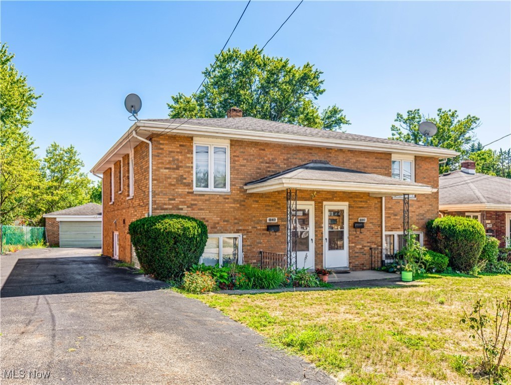 Welcome to this spacious 2-bedroom, 1.5 bath rental in a well-maintained brick multi-family home in Akron. This split-level unit features hardwood floors, large windows that fill the living areas with natural light, and a functional layout with a bright living room, dining space, and a kitchen offering ample cabinetry and counter space. Upstairs you’ll find two comfortable bedrooms with hardwood flooring and a full bath accented by original vintage tile, while a convenient half bath is located on the main level. Additional features include an in-unit, main level laundry area with a utility sink, central air, off-street parking, a detached garage, and shared outdoor space. The owner covers water, sewer, and trash, while tenants are responsible for gas, electric, heating, internet and cable. Situated close to schools, parks, shopping, and highway access, this property combines comfort and convenience in a desirable location.