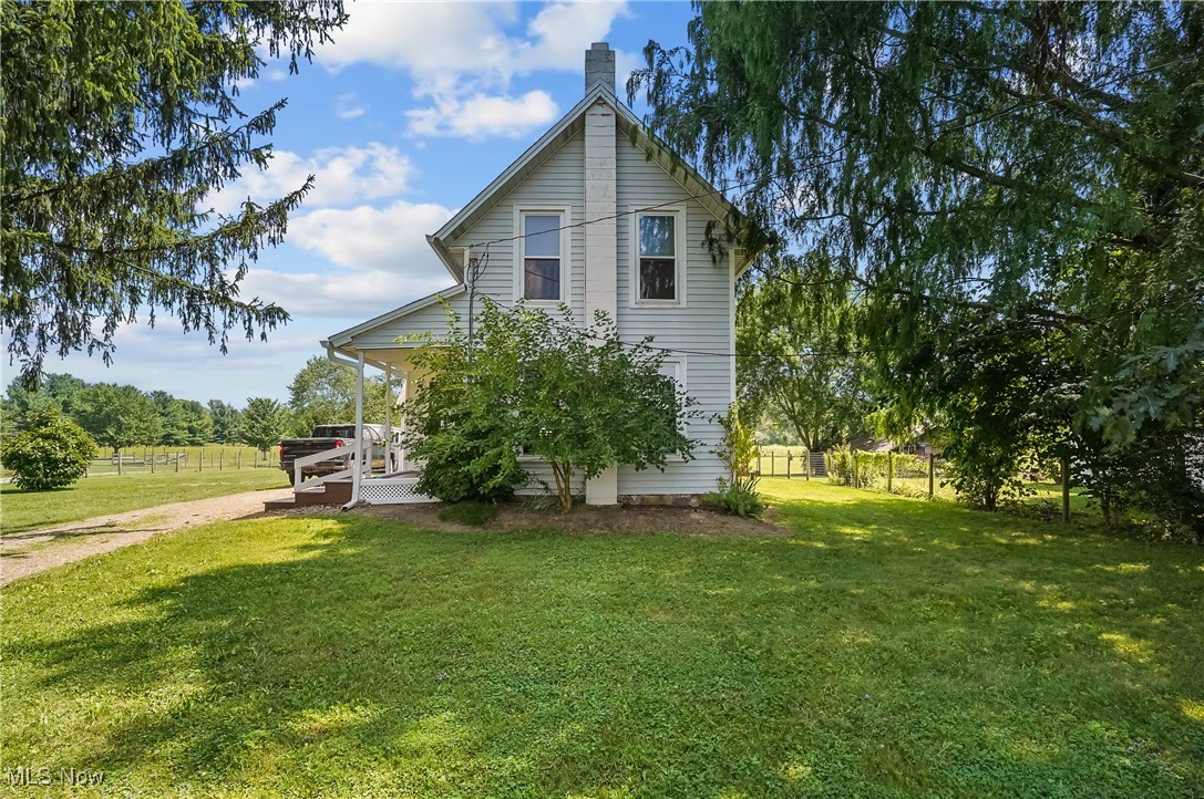 Ever have the dream of starting your own farm? Well, here is your chance right here in Medina, located on 5 ACRES!! A beautifully updated home, 3 outbuildings (one built in 2023), and 3 separate fenced pastures - Gives you plenty of room for goats, cows, horses, chickens, YOU NAME IT! This adorable home with a charming side porch opens to a center gathering/dining room, spacious enough for those holiday gatherings! The adjacent Living Room is just right for your enjoyment! The Kitchen and bath were both nicely updated with soft close doors/drawers, and a mobile center island! Open up the French doors right off the kitchen to enjoy the covered back porch overlooking the pasture, allowing all the natural light to flow in. The first level also includes a bedroom and full bath! The second level shows off a large master bedroom with wall to wall closet space, a NEW 1/2 bath, and second-floor laundry. AND this property backs up to the Chippewa Rail Trail with easy access for hiking, biking and roller blading. Recent updates include a NEW septic system, new french drains in the pasture, updated windows, kitchen, appliances, baths, paint, decor, and so much more. Must see!!