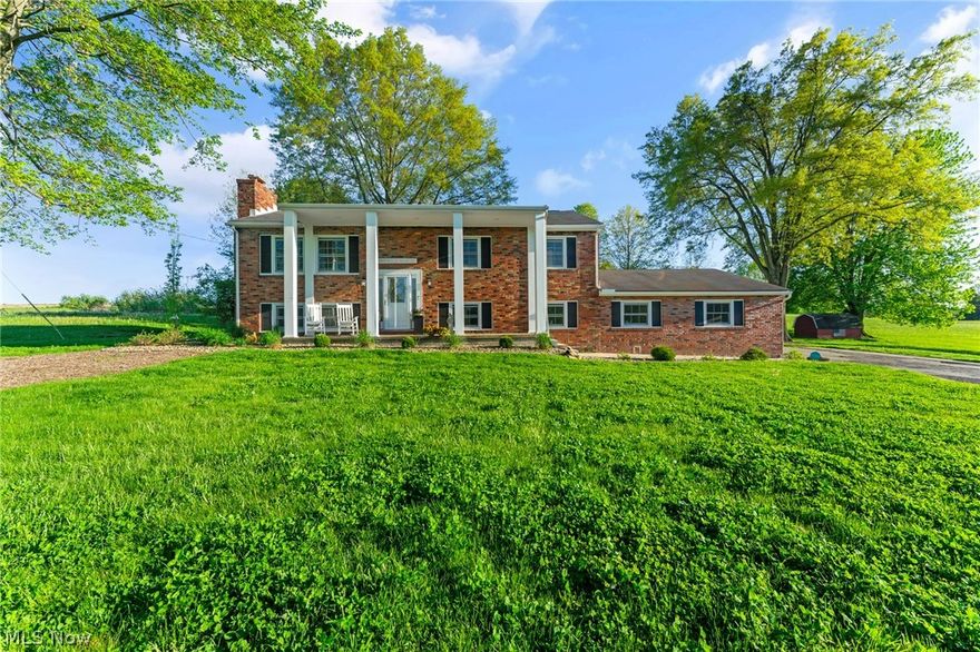 Welcome home to this completely updated 4 bedroom 3 bath home on almost 3 acres!  This home is much larger than it appears!!! All new custom kitchen featuring granite countertops, large center island and stainless appliances with an under counter wine cooler, not to forget the door that leads to the back deck. Two bedrooms are upstairs and two bedrooms downstairs with oversized closet with organizers. First floor master bath has a loversized walk in tile shower and double vanity sinks. The main bathroom is completely updated.  Along with the lower bathroom that is oversized with walk in shower as well. New luxury laminate flooring throughout and hardwood floors in the bedrooms. Lots of closets and storage space! Lower level family room with cozy fireplace and full kitchenette is the perfect place to entertain or would be a great in law suite. This also leads out to the full 18x36 concrete patio. Large laundry room with counters and sink. Attached two car garage with electric. Updates: Reverse osmosis water system,newer furnace, central air, updated electrical, light fixtures, vinyl siding on back, and landscaping. Whole house Generac generator. You must see the inside to appreciate all this home has to offer! This is not a driveby home