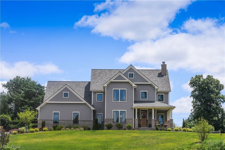 Are you considering building? You must see this home first! This newly constructed modern farmhouse will Wow! you at every turn. Designed with quality and details not found in any other home on the market.  The home sits on 2 beautiful acres, high on a hill in Picturesque Hinckley Ohio. The wrap around porch will be your favorite place to watch the sunsets and welcome your guests.  Inside you will find Hickory wood floors and wood beams which help give this home the feel of warmth and comfort.  The Great room with wood burning fireplace is open to the dining room and kitchen.  The chef's kitchen will astound with quartz countertops, oversized island, handcrafted maple painted cabinets, tile backsplash, 36" gas range, separate electric oven, Stand-alone full-size refrigerator, freezer, and custom hickory range hood.  A mud hall with gorgeous hexagon tile is off the oversized 3 car garage and leads to a full bath and Den. Upstairs reveals the Master Suite of your dreams. Cathedral ceilin