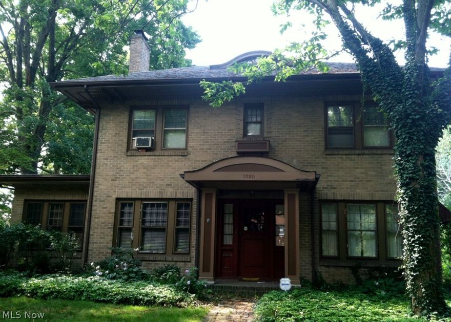 Unique brick colonial located on double lot with many beautiful, mature trees. Open air patio with large yard kept private by newer six foot wooden fence. Interior layout with the charm and detail of a bygone era including arched doorways, 9 foot ceilings and original French doors. Neutral, tiled kitchen extends into cozy breakfast nook. Classic hardwood flooring found throughout bedrooms, formal dining and living areas, extending into the inviting sunroom. Comfortable flow and abundant natural light make this a home a delight for living and entertaining. Recently updated with fresh paint, new carpeting on stairs and upper hallway, boiler in '09 and hot water tank in '12. Full basement and large attic provide ample storage. Personal touches are all that is needed to make this home yours. Motivated Sellers, offers wanted!