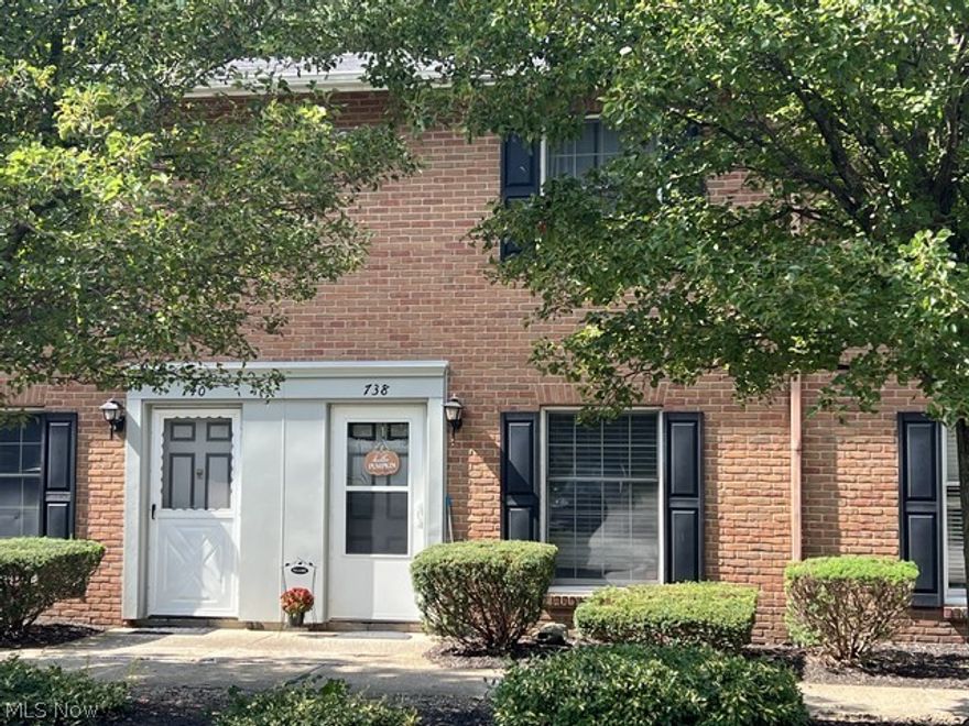 Nothing to do! This two bedroom townhouse is ready. Enjoy the comfortable over sized living room with laminate flooring,half bath adjacent. The spacious kitchen offers all appliances and nicely sized island, laundry neatly located in kitchen.   The second floor has a full bath and two large bedrooms, with the primary bedroom leading to a balcony.  Also, a patio and back yard area.  Carport parking for one vehicle.  Best of all they plow the winter snow for you!