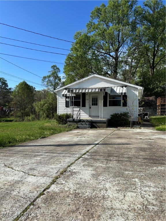 Two bedroom bungalow--one floor living--living room, eat-in-kitchen, one bath and laundry room. Outbuilding. Paved driveway, covered front porch. Lot is mostly level. Conveniently located. Entered for Comp Purposes Only