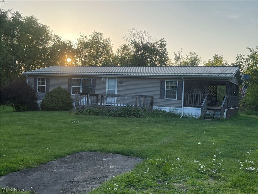 You wanted country and you got it.  5 acres with a 3 Bedroom modular.  The land is perfect to raise kids or cattle.  2 outsheds for tool and tractor storage.  Swing already set up under the maple tree.  Covered front deck to enjoy the morning coffee or listen to the crickets in the evening.  Even though it's in the country, still accessible to St. Clairsville minutes away.  Schedule your appointment today with the agent.