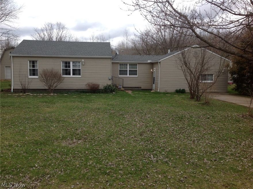 Come and see this charming ranch sitting on over a half acre. Inside you will find a newly remodeled kitchen with new cabinets and countertops. It has 3 bedrooms and a large utility room with lots of room to create storage.  From the dining room, you can step out onto the deck and enjoy the country view. The roof is just a little over a year old.  Also it has a heated garage with an upstairs.