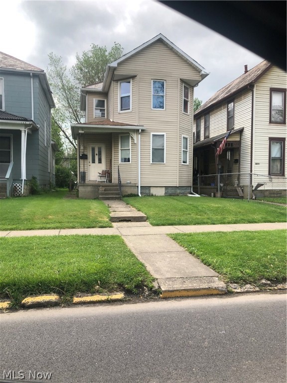 Just added a few more pics as some rooms are currently being painted light grey. This ready to move into home comes with 3 bdrms. Convenient 1st floor laundry. Nice size living room. Main level has additional room could be playroom, den or extra bedroom. Updated windows, and furnace. Extra Parking in rear off alley behind house or in front of home. Seller is currently moving out.