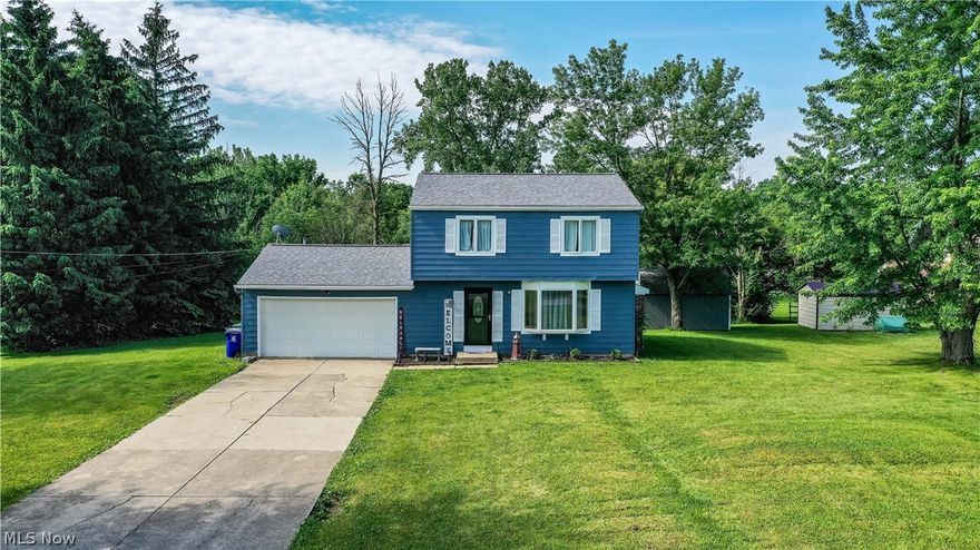 Welcome to this gorgeous updated home that is ready for you to move right in! As you arrive, enjoy the curb appeal of the freshly painted exterior. It has a two car attached garage as well as a shed in the backyard. The living room has a unique picture window and a beautiful fireplace. The spacious kitchen opens up to the dining room which has glass sliding doors that walk out to the back deck. Once in the backyard enjoy the privacy the tree lined property has to offer. Upstairs you will find three spacious bedrooms with brand new carpet throughout. The master suite has its own private access to the full bathroom and two large closets. On the lower level, the finished basement gives you plenty of space for entertaining, complete with a wet bar and wine rack. Laundry room recently updated with built in shelving. Many big ticket items replaced within the last five years including roof, furnace, A/C, carpet, and hot water tank!