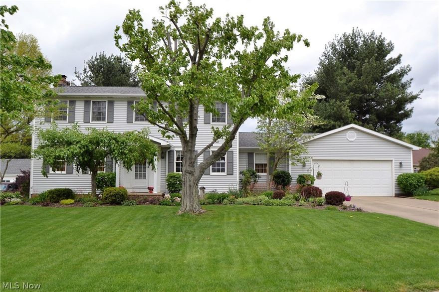 Lots of space in this meticulously cared for 2 story in Colonial Hills.  Wonderful floor plan!  First floor has a spacious formal dining room, oversized great room with fireplace, cozy sunroom with vaulted ceilings, French doors and a walk-out to backyard.  Eat-in kitchen with Corian counters, hardwood floor, tile backsplash and walk-out to backyard patio.  First floor office and laundry.  Second level master suite with full bath, jetted tub, shower, and dual vanity.  Three large bedrooms, second full bath and a fourth bedroom in the finished lower level with full bath.  Beautiful private yard and landscaping.  Updates include: Roof 2011, A/C and Furnace 2009, newer spouting and retaining wall on side of house.