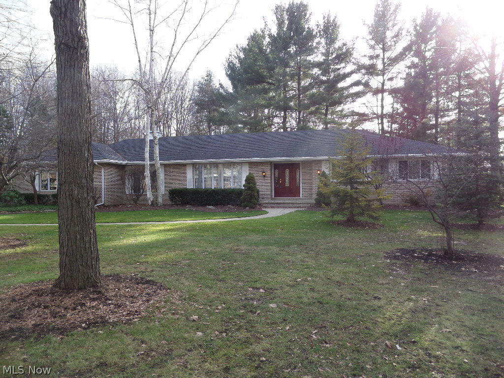 Magnificent quality in this Howland 4 bedroom custom-built brick ranch on 2 wooded lots in preferred neighborhood. Almost completely redone in last 10 years. Neutral decor with new light fixtures. Three full, one half bath. Newer hardwood floors in foyer and formal dining room. Spacious rooms with unbelievable deep California closets and additional storage throughout. Exceptional insulation for low-cost heating. Large gourmet kitchen and eating space. First floor laundry. Fourth bedroom could be office. Fifth bedroom or office and bath in huge finished basement with more storage. Two plus car garage and outbuilding too.