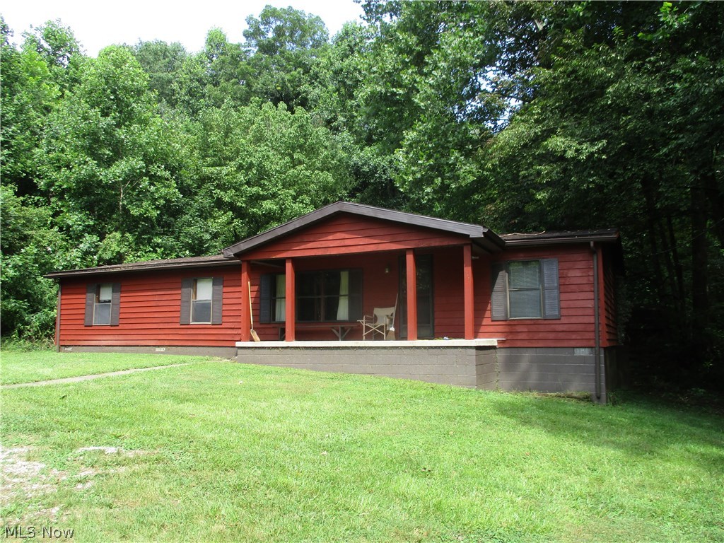 Very Private!! Double wide sitting on 7.33 AC, 3 Bedroom 2 full baths, dining area, laundry room, wood burning fireplace, master bedroom has walk in closet and whirlpool tub in master bath, front porch and back deck, detached 2 car garage, shared driveway.