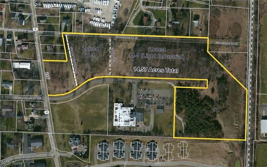 14.57 acres vacant commercial land.  Lake Twp., Village of Hartville, Lake Schools.  The fron 3.5 acres is zoned B-1 and the remaining acres is zoned M-1 Light Industrial.  Sanitary sewer us available.  Open loads of possibilities.  259' frontage on S. Prospect Ave.  Additional frontage on E. Woodland St.