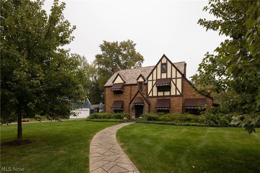 This classic Tudor in historic Ridgewood offers 4200 total sqft, 4 bedrooms, and 3.5 baths. Beautifully maintained and updated throughout with character only available in a fine home of this era. Elegant formal living & dining rooms lead to a study with built-in bookshelves. The spacious family room provides a unique architectural ceiling and striking fireplace. Fully applianced cherry kitchen is adjacent to a breakfast room with built-in bar area.  Spacious master bedroom has 2 walk-in closets & recently updated ensuite bath  Two additional bedrooms share a Jack and Jill bath. A back staircase leads to an office (or 5th bedroom) and additional bedroom with full bath. The lovely backyard is fully fenced and a brick patio overlooks the private property. Come see this fine home and make it your own!