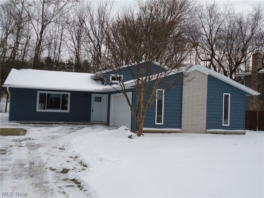 Updates galore in this beautiful split-level home! Walk in to an open concept main floor with Pergo laminate flooring
and abundant natural light. This kitchen will not disappoint! White cabinets with soft-close doors and pull-outs, granite
counter tops, tiled backsplash and fully applianced. Upstairs you will find 3 bedrooms all with newer carpet (Jan 18')
and a fully renovated full bath with tiled shower with soaking tub. Lower level offers a family room option also with
updated carpet and ready to hold your flat screen tv! Laundry room is off the garage and large enough to double as
your mud room. Here you will also find another full bath with updated tile. Backyard offers a patio and storage shed.
Exterior updates include Roof (Oct. 17'), Vinyl siding (Nov. 17") and Gutters (Dec. 17'). Attached over-sized 2 car garage.
Conveniently located near Rt. 8, CVCA & Walsh, Metroparks bike path and restaurants. Voluntary Wyoga Lakes Home
Owners Association allows access to nearby lak