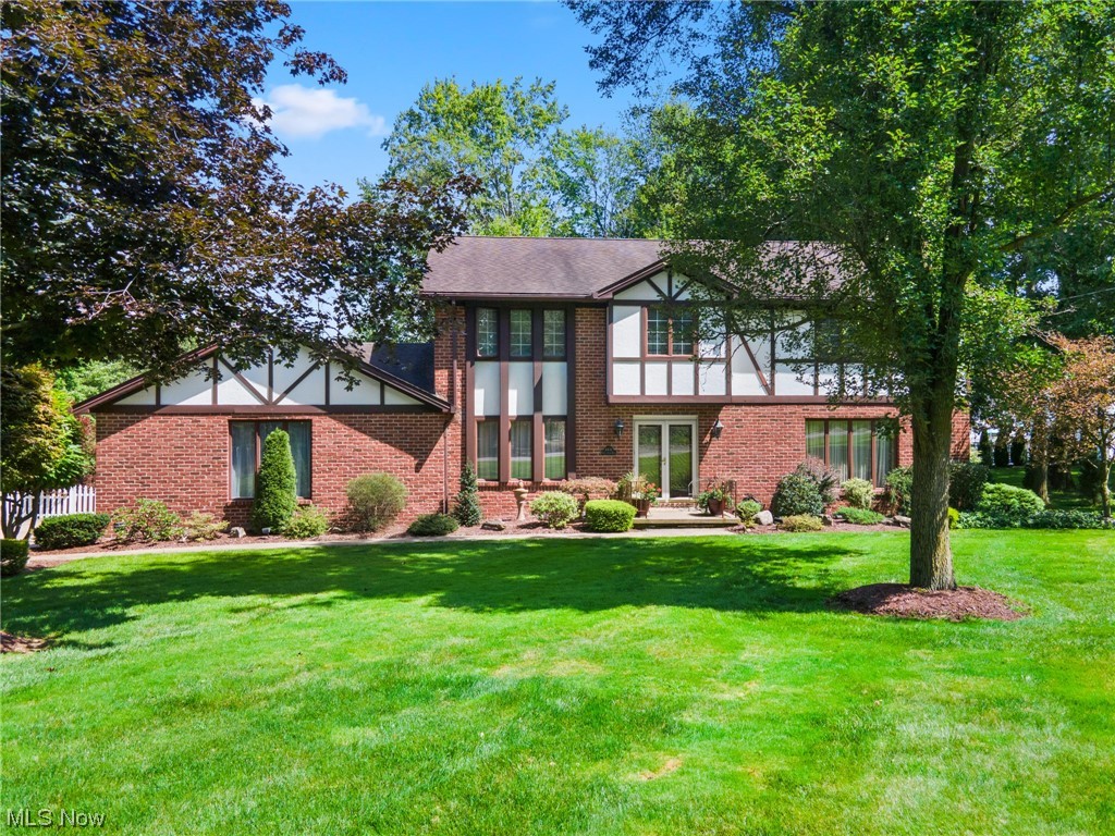 Welcome home to this beautiful colonial 4 bed, 3 bath home seated in Canfield with a private parklike backyard! The eat-in kitchen has been updated and features new cabinets, stainless steel appliances, granite countertops, bamboo flooring, extra large island with seating, and a spacious pantry. Open to the kitchen is the family room with beautiful built-in bookshelves, a gas fireplace, and access to the private office. Off the kitchen you’ll also find a sunroom, first floor laundry and a half bath. The first floor is complete with a formal dining room and front living room with crown molding. Upstairs you’ll find the huge master suite with a large walk-in closet and beautiful bath with floor to ceiling tile shower. The other 3 huge bedrooms are also situated on this floor along with an additional updated full bath and a cedar closet. The waterproofed basement has tons of potential with glass block windows and plumbing for a 4th bathroom. The icing on the cake is the breathtaking backy