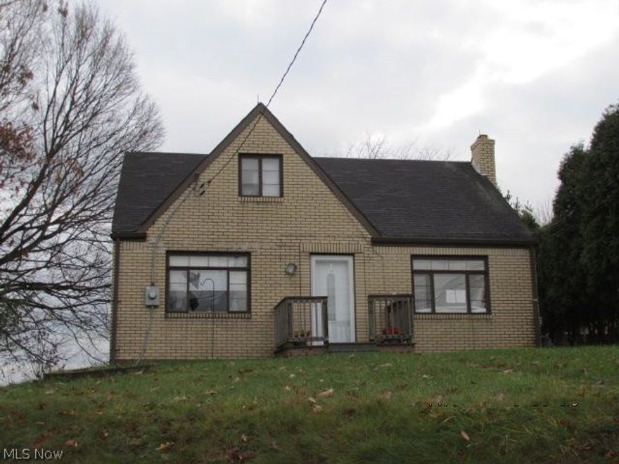 1 1/2 story brick home with three bedrooms and 1 1/2 baths.