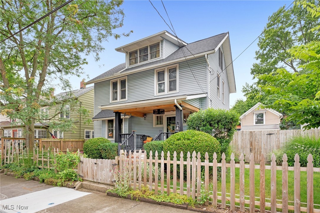 Welcome to classic charm with all the modern amenities! This home is within walking distance of vibrant Highland Square, with friendly neighbors and a sense of community. Well cared for by the current owner of 25 years and professionally updated throughout. Tall ceilings, original woodwork and hardwood floors. Original window bench and front door gives the home character that is rare to find. Electric and plumbing updates, updated vinyl and Anderson wood windows. New roof added in 2023, along with a new water heater and central air. High efficiency gas furnace was recently rebuilt with new key components and in great working condition. Newer Anderson storm door in front and rear with sliding screen windows. The yard is fully fenced with mature low maintenance landscaping and brick patio for entertaining. Enjoy the front porch with new cedar ceiling and fan. The dining room features a ventless gas fireplace and full coat closet. The Shakespearean Era dining suite is available to stay with the home. This 4 piece suite was originally purchased from a Merriman Road home and is a real show stopper! The well designed and updated kitchen offers plenty of cabinet space, newer stainless steel appliances and a pass through window making for a open space. The second floor bedrooms are spacious with tons of tall windows, and deep closets for storage. Gorgeous full bathroom is updated with a new soaking tub and rain shower system with new toilet, flooring, and new LG laundry units - no more going to the basement to do laundry! The third floor master suite is a relaxing retreat up in the trees with vaulted ceilings and tall Andersen windows on all 4 sides and updated private half bathroom with French doors. Large walk in closet with built in shelving. Eaves allow for open windows on rainy nights. This home offers so much charm and updates while providing immediate occupancy - a must see! Give us a call for a private tour.
