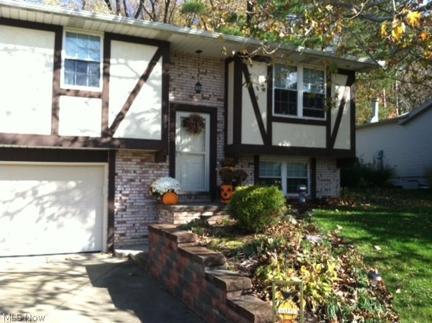 A lot to fall in love with here. Beautiful home in excellent condition, quiet, out-of-the-way Dover neighborhood. Cathedral ceilinged great room, excellent kitchen with granite counter tops and stainless steel appliances. Laminate floors. Private back yard with paver patio, well landscaped with stone walls. Huge garage, concrete drive with b-ball hoop. A home your family will cherish and enjoy. Approximately 1,054 square feet on the first floor plus about 480 in the finished lower level. Laminate floors and Granite counter tops approximately 5 years old. Roofing, gutters and downspouts 1 year, water heater 2 years, furnace and A/C 8 years, stainless appliances 4 years, windows 6 years, custom blinds 1 year, bath remodel 4 years. Paver patio by Goodings and professionally landscaped by B & H.