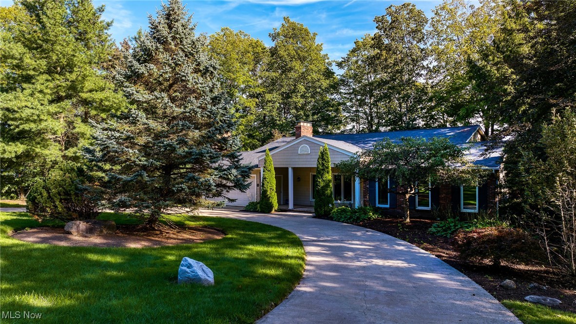 Welcome to Tanglewood This stunning home opens with curb appeal that feels like a whispered welcome. The entrance invites you in with a bright, airy stance, guiding you toward the heart of the home. The great rm greets you 1st soaring ceilings, a brick wall firplce, & a wall of windows that pours in sunlight, turning the space into a living painting. From there, you drift into the dining rm, framing every meal as guests mingle. The eat-in kitchen, a warm hub w/ all the conveniences & slider that spill onto the deck overlooking the golf course & lush green gardens. The rhythm continues through the multi-level decks unfold like a well-scripted scene, perfect for sunlit breakfasts, shaded chats, & moonlit gatherings, all framed by expansive course greenery. The walk-out lower level becomes the showstopper for entertaining: a sunlit haven with a wall of windows that bathes the space in natural light, a cozy fireplace, & a stylish bar set for memorable evenings. Lrg slider open seamlessly to the back patio, creating an effortless indoor-outdr flow that invites guests to mingle from the bar to the patio & a 4th Bedroom and full bath w/steam shower . The 2nd- level reveals the primary suite a private sanctuary w/ a balcony off the bedrm, a generous walk-in closet, & an en-suite that whispers luxury. 2 add bedrms share a full bath, arranged for comfort & quiet, with views that bring the outdoors inside. Back to the exterior rhythm, a 2-car garage anchors the lower level where you can create a gym, home theater. Live life surrounded by an inviting community, walk to the club, the golf course, the venue, snack bar, pro shop, tennis courts, & a private lake everything you crave within easy reach, all while preserving a mood of private, relaxed luxury. The Historic Tanglewood Club is a public championship golf course & one of Chagrin Valley's most notable lakes all located in the rolling hills of the Tanglewood Lake development in Chagrin Falls awaits you. See link for video