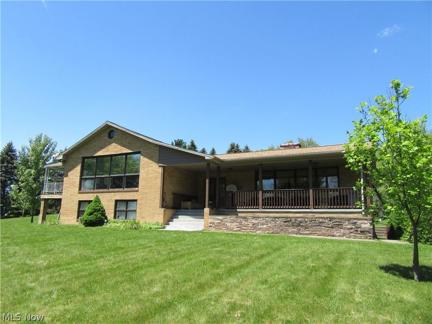 Beautiful view of Lake Tomahawk on your 10X33 new porch. Brick Split Level on 1.164 acre lot. Has many improvements. Hugh Family & Great rooms, 200 AMP electric, newer Lennox furnace & air, extra insulation, newer roof. Bank barn has newer roof. Across the street from swimming area, tennis, basketball, shuffleboard, horseshoes, swing/jungle gym, driving range, boat marina, pavilion area along with boating on this 150 Acre private members Lake. For all your boats and toys!