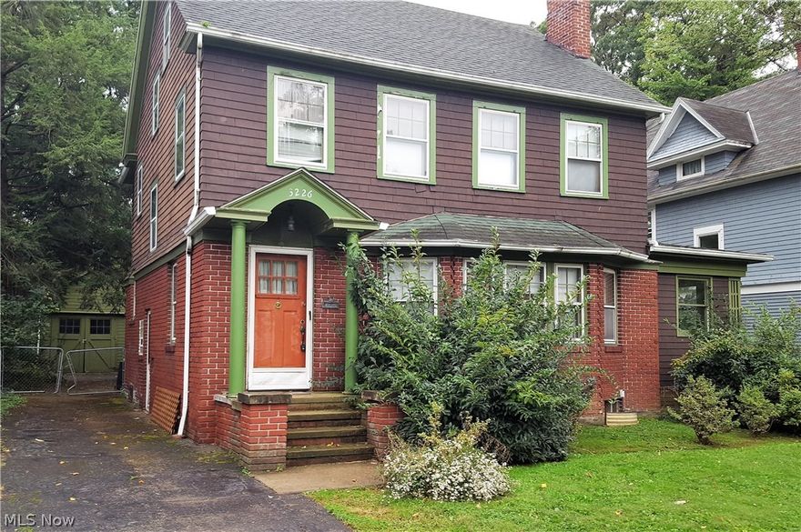 Great opportunity to polish up this "hidden gem"! Spacious home in popular Cain Park neighborhood. You will appreciate the original hardwood floors, trim, and architectural details. Gracious living room with beautiful fireplace and a bow window which bathes the rooms in natural light. A formal dining room adjoins a generous kitchen. Convenient screened in porch as well! First floor powder room. Three bedrooms and full bath on second floor. More space on third floor! Detached two car garage. POS online, buyer to assume violations. See it today!