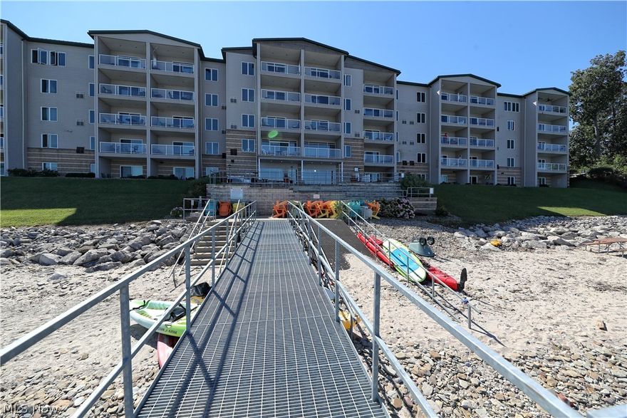 Welcome to the luxurious Lakefront condominiums of Lake Erie Vista at Geneva-on-the-lake! These condominiums consist of 47 luxury units within a 5 story, 2 elevator serviced building that overlooks a private beach along Lake Erie. This is an end unit with breathtaking views throughout the open floor plan. The upgraded kitchen provides granite counter tops, tons of cabinets for storage as well as a large island with bar-top seating. From the living room, walk out onto the private balcony with stunning Lake Erie views. The perfect spot for your morning coffee and watching the amazing sunrise. The master en-suite features a huge walk-in closet with built-ins and a stunning master bath with a step-in, tiled rain shower and his and her vanities. There is a second master suite that has a full bathroom as well as a walk-in closet. The third bedroom offers a large custom built in desk that would make for a great office or guest bedroom. Lake Erie Vista offers a community room, an indoor heated
