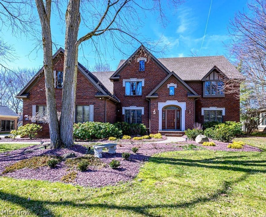 BEAUTIFUL, PRISTINE Home in Poland was formerly Builder's Model Home! This Quality built home is full of surprises featuring coiffered and detailed ceilings throughout, crown molding, large baseboards, Palladium Windows, 2 staircases, a ton of storage and much more! First floor office could be 5th Bedroom. This home welcomes you into a two story foyer with 3 closets, detailed open stairs and wainscoting. Lovely Living Room has wainscoting, large picture window and detailed ceiling. The Formal Dining room, with raised ceiling, focuses on Custom Stained Glass Windows. Large Gourmet kitchen features granite countertops, Stainless appliances, Gas Range, Wet Bar with copper sink, large pantry and an abundance of cabinets! Kitchen flows into the 2 story Great Room featuring solid wood panelled wall with Large Brick Fireplace flanked by Palladium windows that soar towards the ceiling! Back open staircase leads to 4 large bedrooms on the 2nd floor including the Master Suite with newly remodele