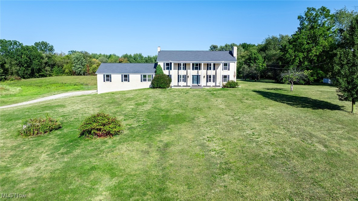 Stunning updated 4777 square foot colonial on over 36 acres in the serene countryside of Randolph Township. Enter through the brand new front door into a grand foyer. To your right enjoy the massive living room with a fireplace. Just beyond the foyer you find the beautiful sprawling eat in kitchen with brand new cabinets and leathered granite counters. Sunny and spacious dining room and family room with a second fireplace flank the kitchen. Beyond the family room you'll find the first of two Primary Suites, complete with its own sitting room and huge walk in closet, perfect for multi generational living. First floor also includes a huge laundry/mud/craft room (endless possibilities!) and a second full bathroom. Upstairs offers a second expansive suite with multiple closets and an updated en suite bath which includes a soaking tub and separate shower. Down the hall is another full bath and 2 additional spacious bedrooms, both with great closet space. Multiple cozy nooks and crannies and incredible storage throughout. Full unfinished basement with a second laundry area, endless storage and a workshop. Brand new windows, paint and carpet throughout the entire home, as well as new front and back doors. Efficient Geothermal HVAC. Newer roof. Additional 24x24 outbuilding. This bucolic property offers rolling hills, woods, a stream and endless wildlife. Welcome to your forever home!