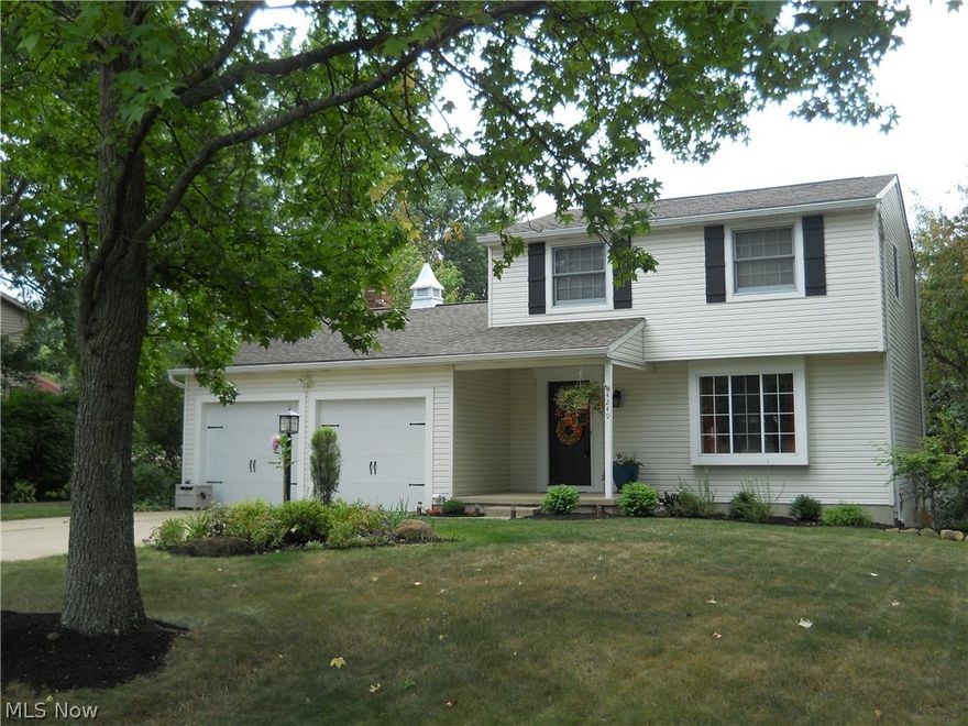 Stunning inside & out 3 bedroom/1.5 bath colonial w/approx. 1702SF including finished walk out lower level on private & beautifully landscaped lot centrally located in City of Green close to schools, library, shopping & expressway* Living room w/bay window & updated carpet* Spacious updated eat in kitchen w/ceramic floor & back splash, breakfast bar, mega cabinets having roll out shelves, trash drawer & pantry plus range, dishwasher, microwave & disposal* 1st floor family room w/brick wood burning fireplace (hearth & mantle) & Pella slider w/built in blinds to deck w/ pergola* 1st floor half bath* Master bedroom w/private access to oversized bath & 2 guest bedrooms complete the second floor (stairs & hallway w/updated carpet)* Walk out lower level w/finished recreation room & slider to patio* Plenty of storage & work space in unfinished part of basement, plus additional access door to covered patio...ideal for workshop* 2 car attached garage* Kinetico water softener* 2 laundry chutes (