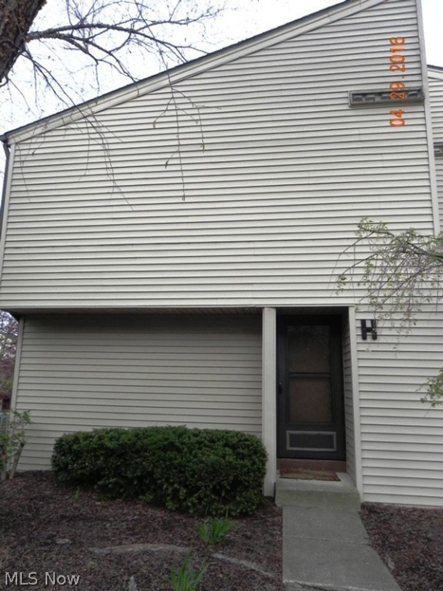 Create your own tranquility with this beautiful 3-bedroom end unit townhouse with serene pond setting with water feature. Step right out onto the deck and enjoy lounging around or entertaining guests as you listen to the tranquil sounds.  The home offers a newly renovated kitchen with new cabinets, granite counter top, hickory hardwood flooring, stainless steel appliances and includes a pantry.  The ½ bath is located on the 1st level of the home and has been updated with pedestal sink and marble flooring.  Gorgeous hardwood oak flooring is throughout the remaining areas of the home. Bedrooms are generous in size located on the 2nd level along with the full bath and laundry area.  The condo comes with one dedicated garage parking spot an additional parking is available for $35 a month. Just minutes away from Crocker Park, I-90 and Park n Ride.