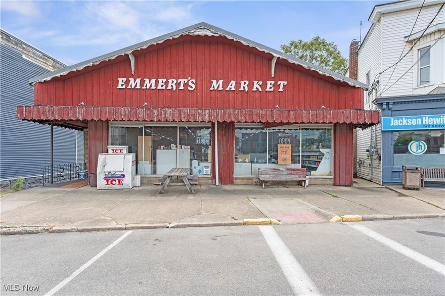 Historic grocery store building located in the heart of downtown Navarre. This charming property offer's a rich history, serving as a longtime local market for the community. The building features classic architecture, complete with original block walls, large display windows, and vintage signage that adds character to the façade. The main floor offers a spacious retail area, perfect for a grocery store or any other business venture. Additionally, the property includes a three-bedroom living space on the lower level, ideal for owners or tenants seeking a convenient downtown lifestyle. The space is a open concept design, retaining its historical charm. Enjoy proximity to local shops, restaurants, and community events, making this a prime location for both business and residential living. Don't miss your chance to own a piece of Navarre's history!