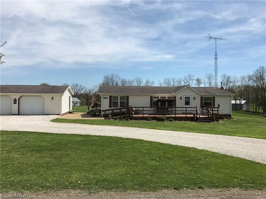 Looking for that perfect place with a couple acres and beautiful views?  You can stop looking!  Rolling hills and a porch to rest on, 3 bedrooms and 2 full bathrooms, this home has it all!   Nothing to do but move in and be at home.  Very nice detached two car garage with room for a work bench and a 10X14 Weaver building insulated with electric on a permanent foundation.  Call today to view this property!