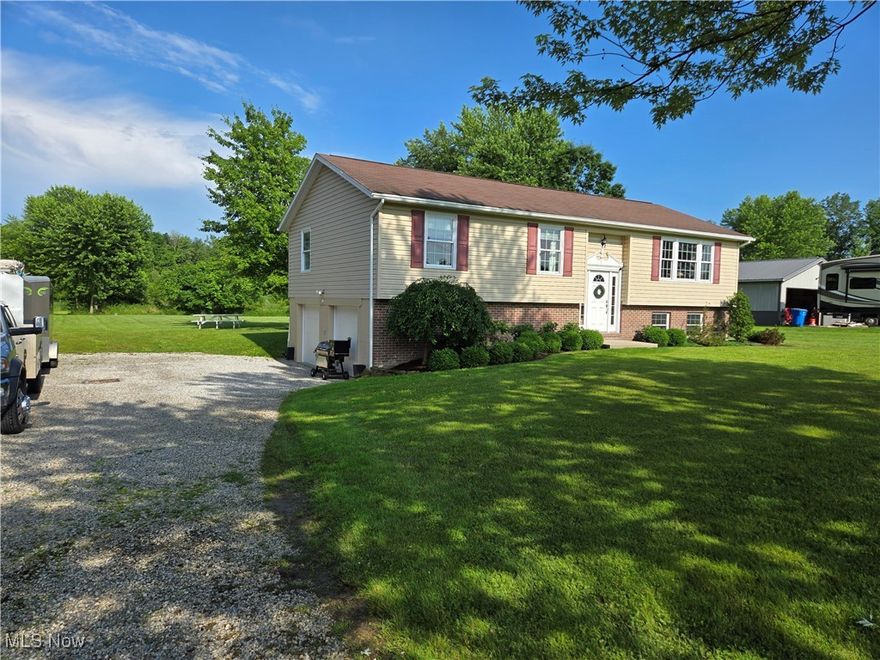 This raised ranch/Bi-level style home has been impeccably maintained and features custom updates throughout. The home owner has his own contracting business and they spared no expense while updating over the years. It features custom finished Hickory floors, kitchen remodel in 2016, bedrooms remodeled in 2024 including custom bedroom closets with auto on/off lighting. The main floor full bath was remodeled in 2024 and features heated floors, auto on/off lighting, and Venetian Plaster walls (which are waterproof and low maintenance!). The lower level was remodeled in 2020 including an additional full bath with heated floors. All mechanicals are new/newer and there was also a driveway drainage project that was completed in 2020. The new owner gets all of this and just a few minutes outside of Middlefield!