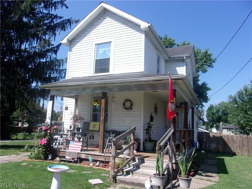 Great starter home with wrap around covered front porch, deck & fenced back yard.  New floor coverings in front two rooms, 2 car detached garage. Home has living room, eat-in kitchen, 3 bedrooms, first floor laundry & bath. Gas heat, city water & sewer.