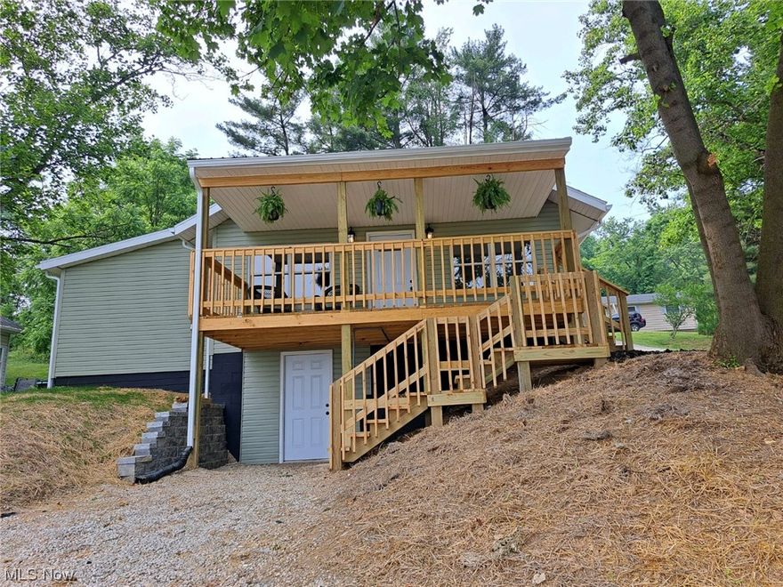 JUST LIKE A BRAND-NEW HOME!  This 4 bedroom, 1 bath home has everything new from porch/decking, siding, roof, windows, driveway on the exterior to all new doors, flooring, paint, lighting, hot water tank, furnace/AC, Pex waterlines, kitchen cabinets, countertops, and bathroom in the interior!  The "L-shaped" living room is brightly lit with plenty of windows to watch the leaves change color in the fall.  The kitchen with recessed lighting is large enough for many cooks and a dining room table.  The 4 bedrooms are split with 2 on each side of the house with the bathroom between 2 bedrooms.  Enjoy your morning coffee on the awesome, covered front porch or have a cookout on the back deck off the kitchen.  There's a full, walkout basement with a washer/dryer hookup, is somewhat plumbed for another bathroom, and could have a garage in the basement level or one built on the back of the property.  Plenty of off-street parking.  Don't miss the opportunity to own this modern, remodeled home at