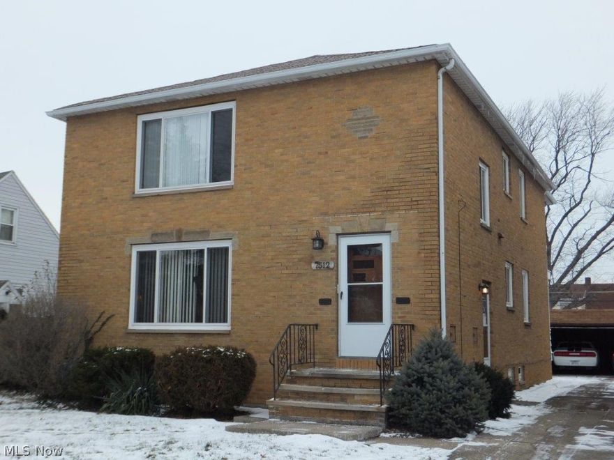 Beautiful brick 2 family home... Solid & well cared for! Spacious layout in each unit. Featuring hardwood floors throughout. Recent improvements include: Vinyl replacement windows (3 yrs); hot water tank (3 yrs); glass block windows (3 yrs); 2 bathroom updates (Approx. 5 yrs). Each unit has a formal dining room and a sun room addition. Full basement with built-in storage closets. 2 car detached garage.